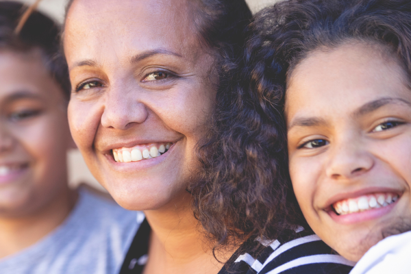 Mum smiling with her son and daughter