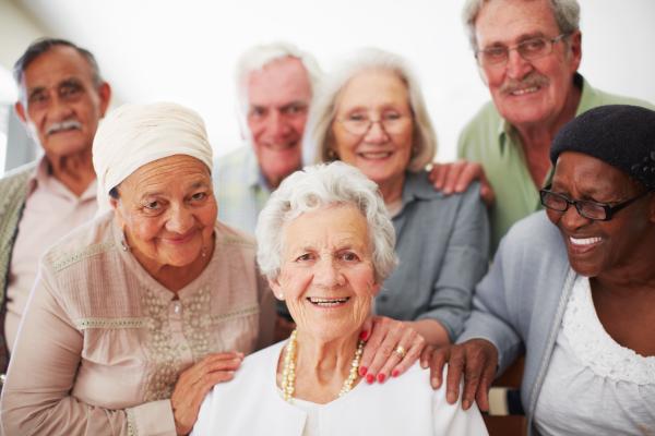 group of older people from different cultures smiling
