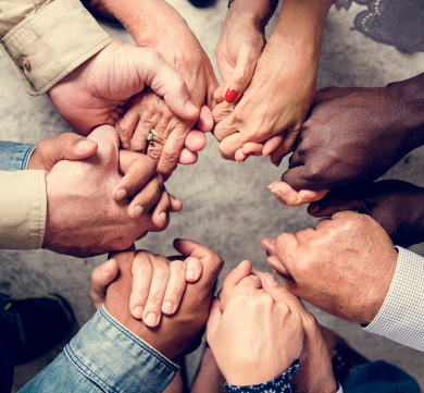 Group of people holding hands